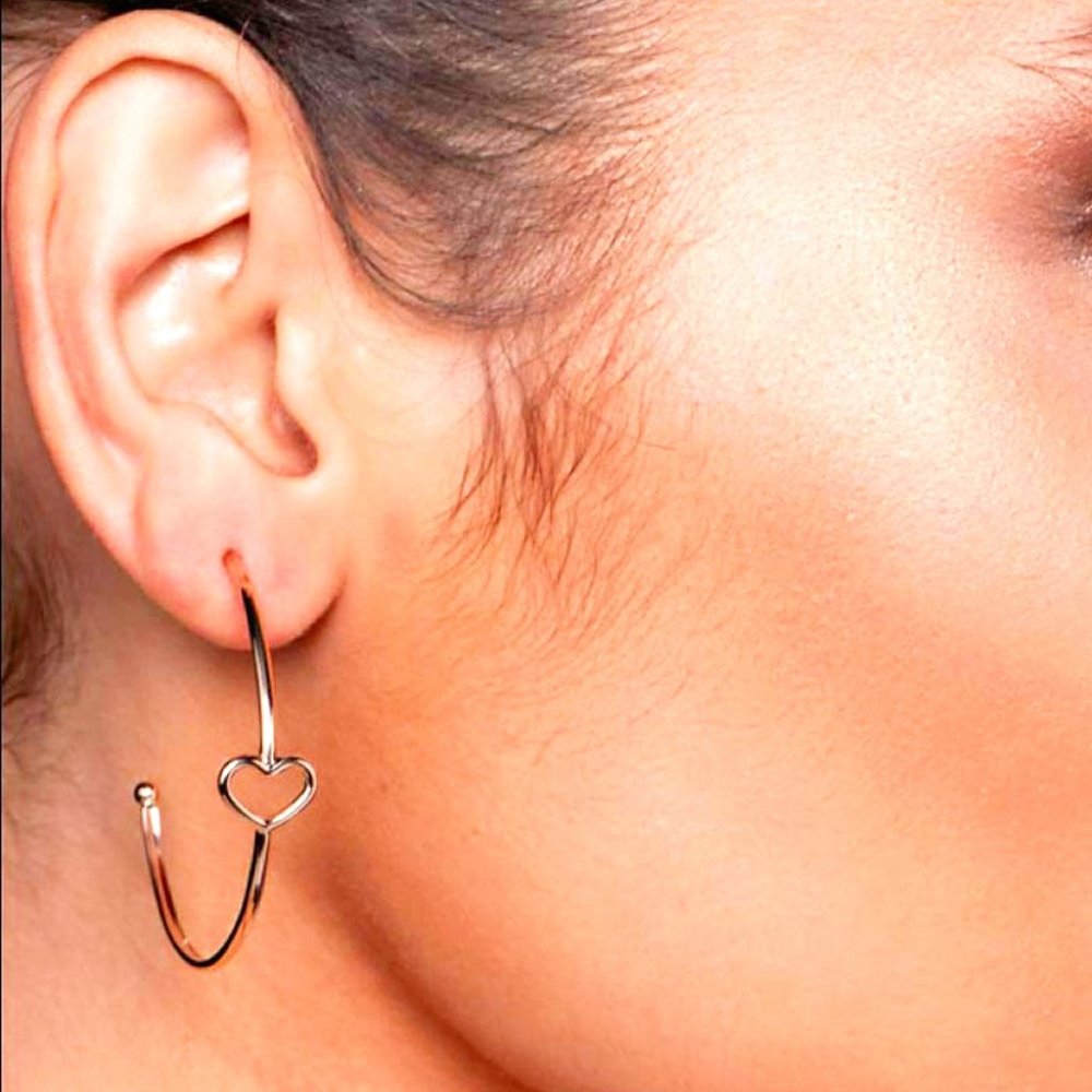 Gold plated half-hoop earring with a heart